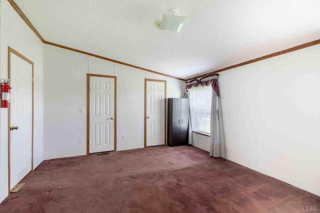 7026 Midway Rd, Phenix, VA 23959 - unfurnished room with ornamental molding, a textured ceiling, carpet, and lofted ceiling