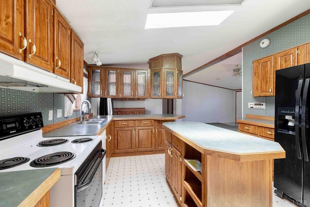 7026 Midway Rd, Phenix, VA 23959 - kitchen with range with electric cooktop, black fridge with ice dispenser, under cabinet range hood, light flooring, and brown cabinets