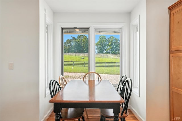 1433 Piney Mountain Rd, Appomattox, VA 24522 - dining area with baseboards and light wood-style floors