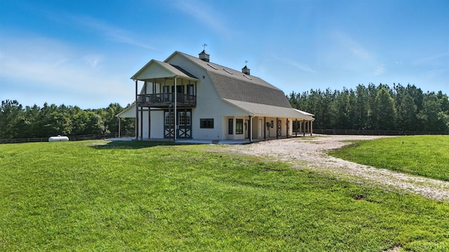 1433 Piney Mountain Rd, Appomattox, VA 24522 - rear view of house with a balcony, a chimney, a forest view, and driveway