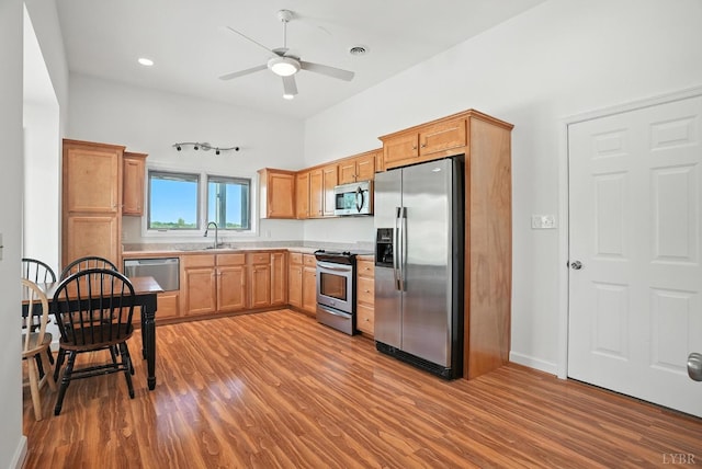 1433 Piney Mountain Rd, Appomattox, VA 24522 - kitchen featuring appliances with stainless steel finishes, wood finished floors, light countertops, ceiling fan, and recessed lighting