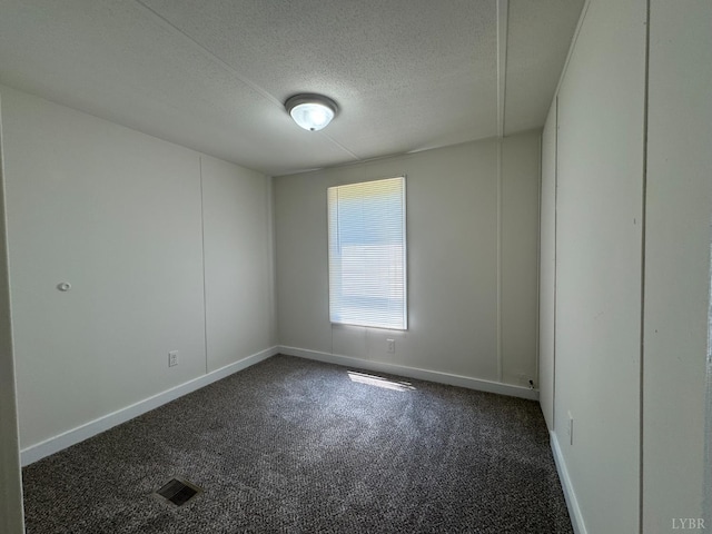 3687 Old Grist Mill Rd, Appomattox, VA 24522 - spare room featuring dark carpet and a textured ceiling