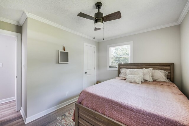 387 Stage Rd, Amherst, VA 24521 - bedroom featuring wood finished floors, ornamental molding, a ceiling fan, and a textured ceiling