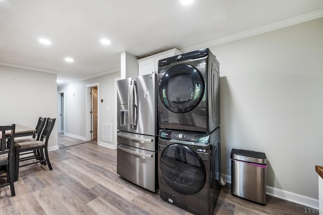 387 Stage Rd, Amherst, VA 24521 - washroom featuring stacked washer / dryer, ornamental molding, light wood-style flooring, and recessed lighting