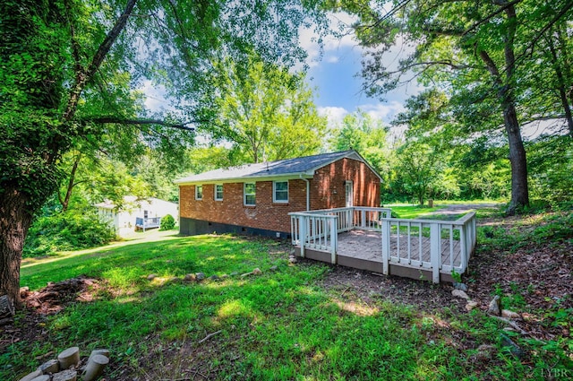 387 Stage Rd, Amherst, VA 24521 - back of property with a deck, brick siding, and a yard