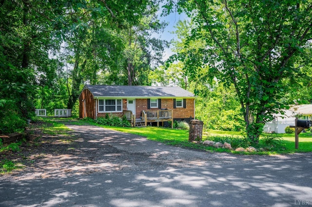 387 Stage Rd, Amherst, VA 24521 - single story home featuring brick siding, driveway, and a deck