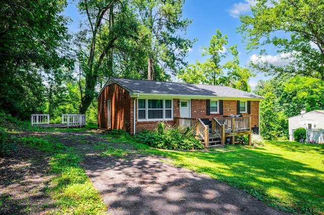 387 Stage Rd, Amherst, VA 24521 - view of front of home with brick siding, a front lawn, and a wooden deck