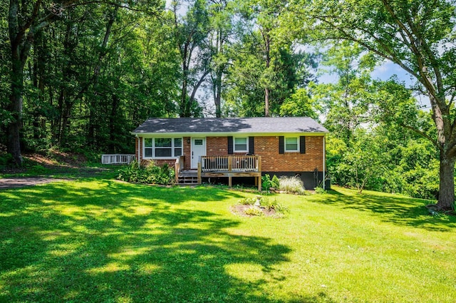 387 Stage Rd, Amherst, VA 24521 - view of front of house featuring brick siding, a wooden deck, and a front lawn