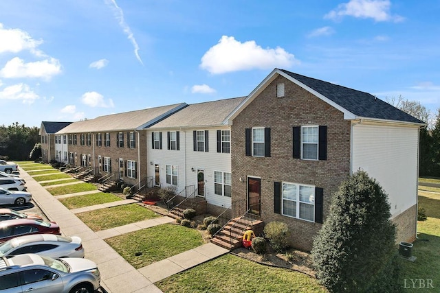 1036 Middle View Dr, Forest, VA 24551 - view of front of property with brick siding, a front lawn, and uncovered parking