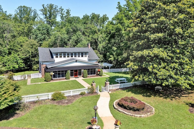 519 Belvedere St, Lynchburg, VA 24503 - view of front facade featuring a porch, a fenced front yard, roof with shingles, and a view of trees