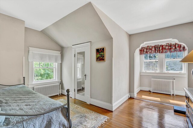519 Belvedere St, Lynchburg, VA 24503 - bedroom featuring radiator, wood finished floors, and vaulted ceiling