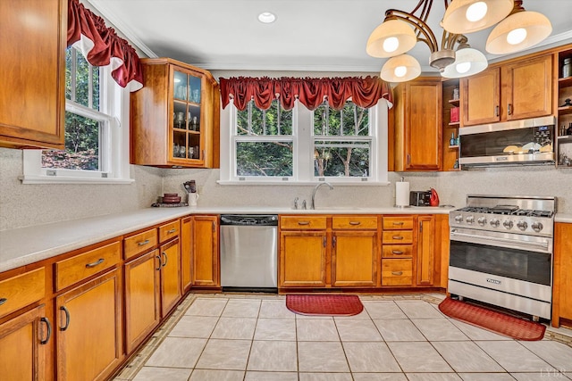 519 Belvedere St, Lynchburg, VA 24503 - kitchen featuring appliances with stainless steel finishes, open shelves, light countertops, and brown cabinetry