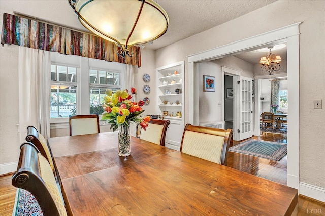 519 Belvedere St, Lynchburg, VA 24503 - dining space with wood finished floors and a chandelier