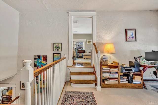 519 Belvedere St, Lynchburg, VA 24503 - staircase with a textured wall and carpet flooring