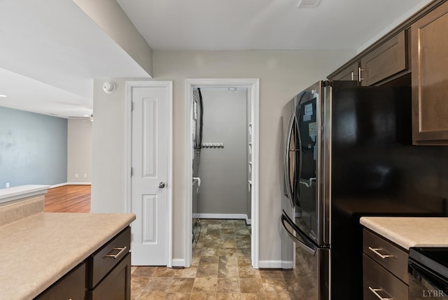202 Bonterra Pl, Lynchburg, VA 24501 - kitchen with black appliances, light countertops, dark brown cabinetry, and ceiling fan
