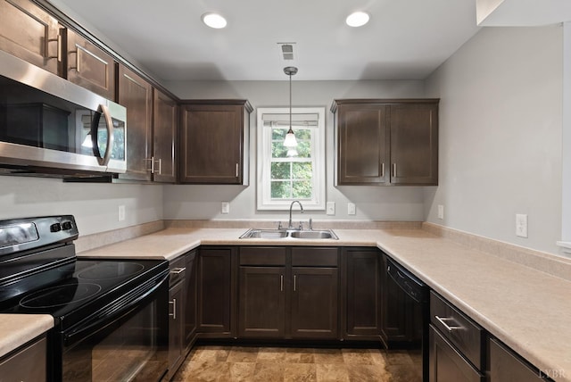 202 Bonterra Pl, Lynchburg, VA 24501 - kitchen with black appliances, dark brown cabinetry, recessed lighting, light countertops, and hanging light fixtures