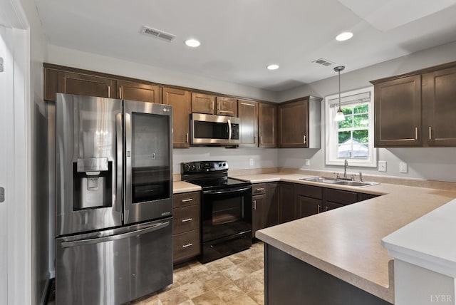 202 Bonterra Pl, Lynchburg, VA 24501 - kitchen featuring stainless steel appliances, recessed lighting, light countertops, dark brown cabinetry, and pendant lighting