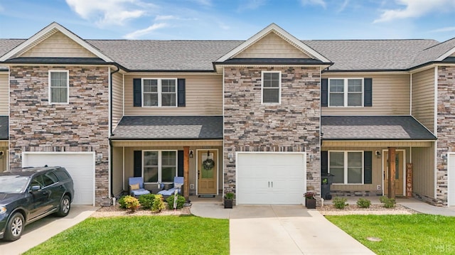 1055 Graystone Ln, Forest, VA 24551 - craftsman-style home featuring stone siding, concrete driveway, an attached garage, covered porch, and a shingled roof