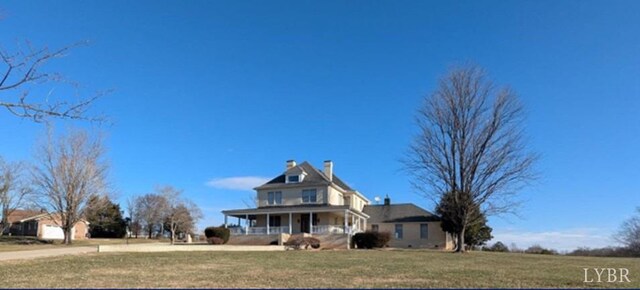 4059 Lowry Rd, Goode, VA 24570 - view of front of house featuring a porch, a front lawn, and a chimney