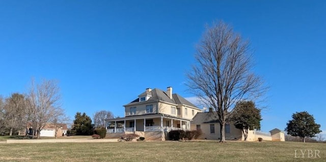 4059 Lowry Rd, Goode, VA 24570 - view of front of property with covered porch, a front lawn, a detached garage, and a chimney