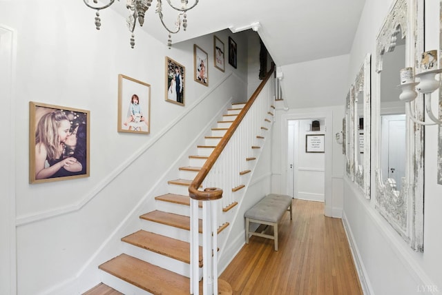 2212 Rivermont Ave, Lynchburg, VA 24503 - staircase with wood finished floors and a chandelier