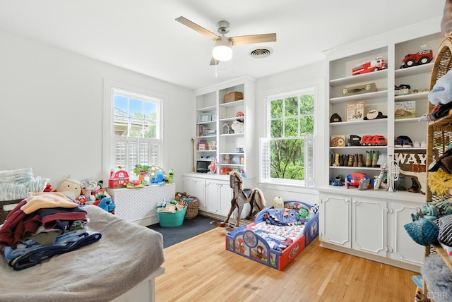 2212 Rivermont Ave, Lynchburg, VA 24503 - game room with plenty of natural light, ceiling fan, and light wood-style floors