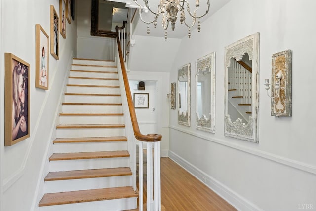 2212 Rivermont Ave, Lynchburg, VA 24503 - staircase featuring wood finished floors and a chandelier