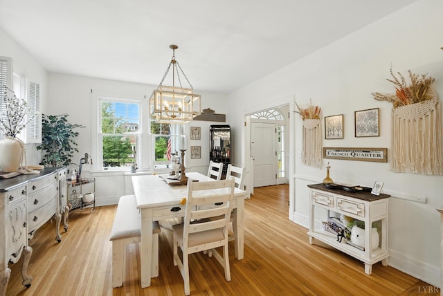 2212 Rivermont Ave, Lynchburg, VA 24503 - dining room featuring light wood finished floors and a chandelier