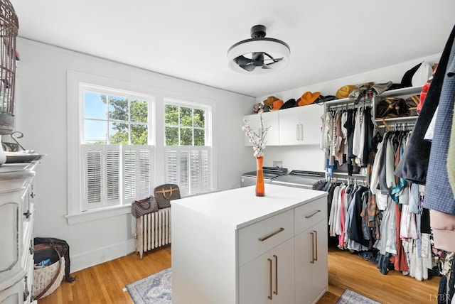 2212 Rivermont Ave, Lynchburg, VA 24503 - walk in closet featuring radiator and light wood finished floors