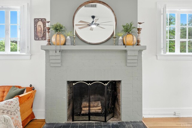 2212 Rivermont Ave, Lynchburg, VA 24503 - detailed view of a fireplace, ceiling fan, and wood finished floors