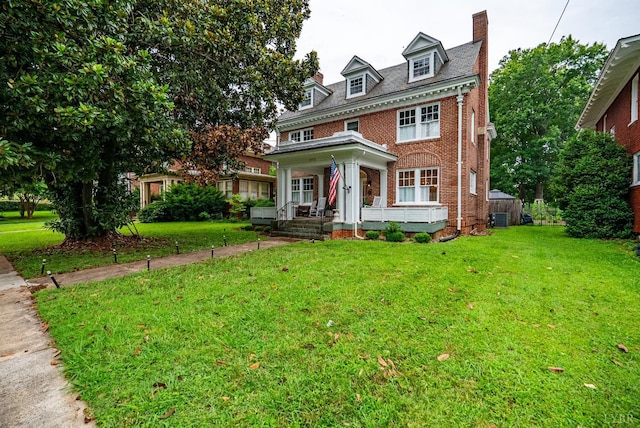 2212 Rivermont Ave, Lynchburg, VA 24503 - colonial home featuring brick siding, a porch, a front lawn, and a chimney