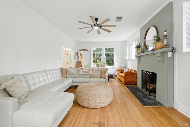 2212 Rivermont Ave, Lynchburg, VA 24503 - living area with a ceiling fan, a fireplace, wood finished floors, and ornamental molding