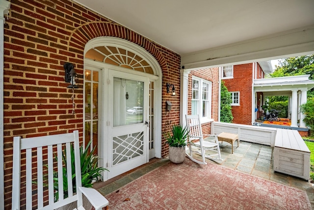 2212 Rivermont Ave, Lynchburg, VA 24503 - entrance to property featuring a porch and brick siding