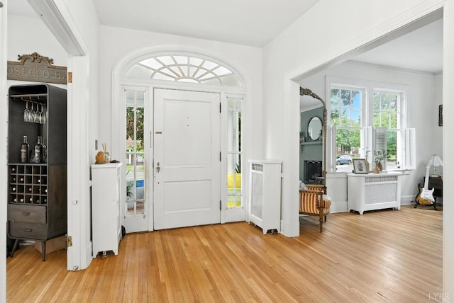 2212 Rivermont Ave, Lynchburg, VA 24503 - foyer entrance featuring radiator heating unit and light wood finished floors