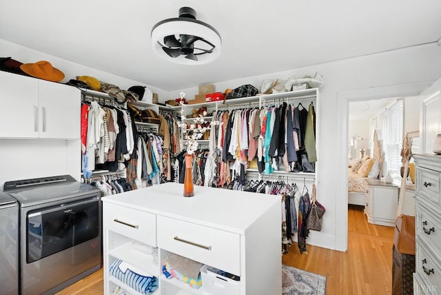 2212 Rivermont Ave, Lynchburg, VA 24503 - walk in closet featuring washer and clothes dryer, a ceiling fan, and light wood-style floors