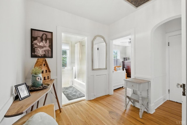 2212 Rivermont Ave, Lynchburg, VA 24503 - foyer entrance featuring light wood-style flooring, arched walkways, and plenty of natural light