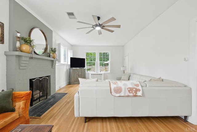 2212 Rivermont Ave, Lynchburg, VA 24503 - living room with a ceiling fan, a fireplace, and wood finished floors