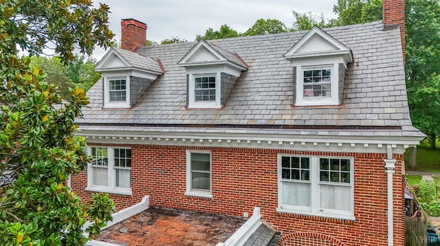 2212 Rivermont Ave, Lynchburg, VA 24503 - view of front of house with a chimney, brick siding, and a high end roof