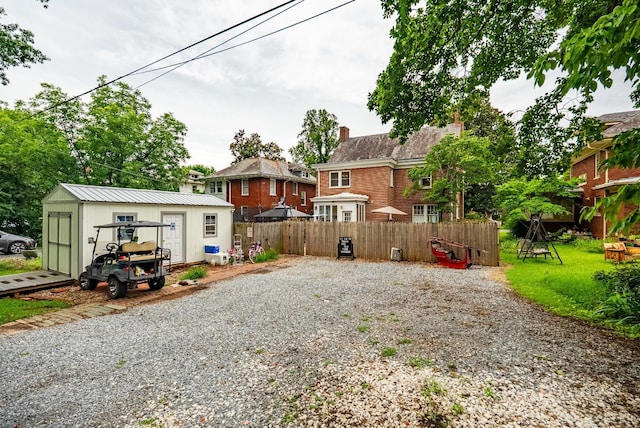 2212 Rivermont Ave, Lynchburg, VA 24503 - view of yard with gravel driveway and a storage shed