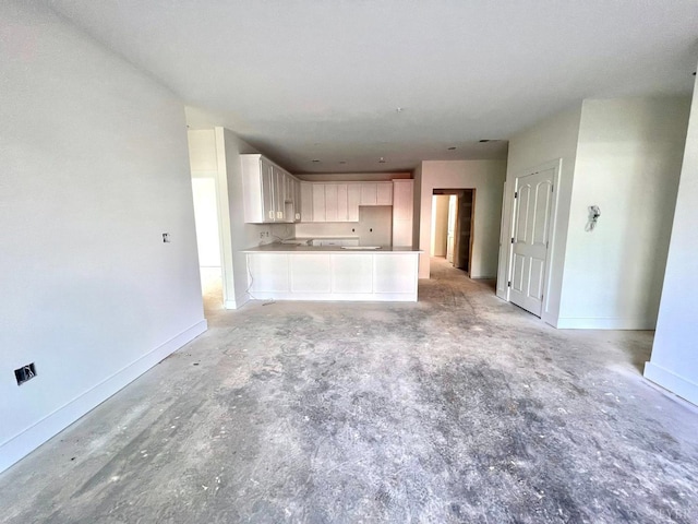 420 Capstone St Unit 107, Lynchburg, VA 24502 - unfurnished living room featuring unfinished concrete floors and baseboards