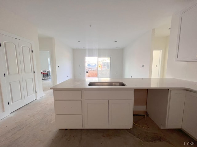 420 Capstone St Unit 107, Lynchburg, VA 24502 - kitchen featuring white cabinetry, light countertops, and a peninsula