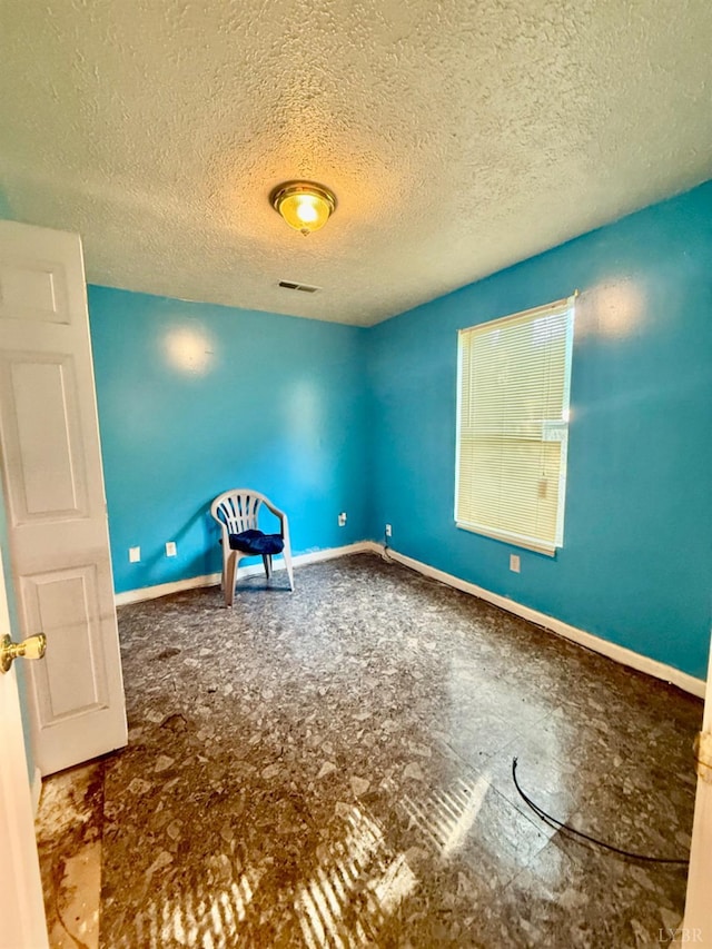 1119 Tyree St, Lynchburg, VA 24504 - spare room with a textured ceiling and baseboards