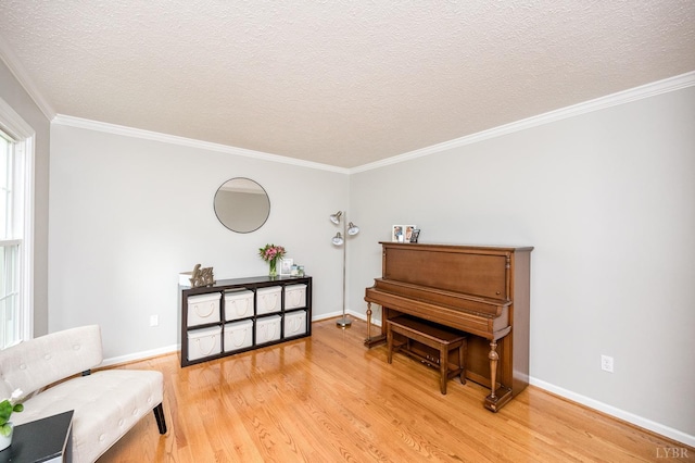 102 Stirling Ct, Forest, VA 24551 - sitting room featuring light wood-style floors, ornamental molding, and a textured ceiling