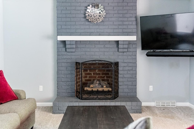 102 Stirling Ct, Forest, VA 24551 - carpeted living area featuring a brick fireplace and baseboards
