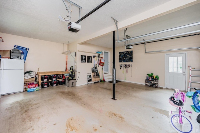102 Stirling Ct, Forest, VA 24551 - garage with freestanding refrigerator and a garage door opener