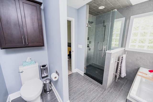 102 Stirling Ct, Forest, VA 24551 - ensuite bathroom featuring a stall shower and tile walls