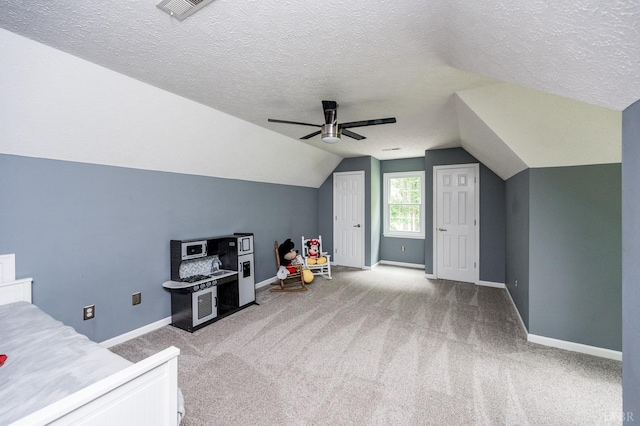 102 Stirling Ct, Forest, VA 24551 - recreation room featuring a ceiling fan, a textured ceiling, carpet flooring, and lofted ceiling