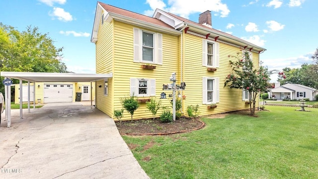 740 W 2nd N St, Morristown, TN 37814 - view of side of property featuring driveway, a chimney, and a lawn