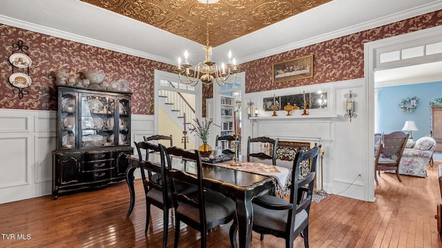 740 W 2nd N St, Morristown, TN 37814 - dining space with an ornate ceiling, wood finished floors, wainscoting, and wallpapered walls