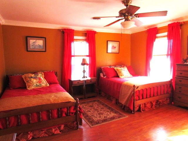 740 W 2nd N St, Morristown, TN 37814 - bedroom featuring multiple windows, a ceiling fan, crown molding, and wood finished floors